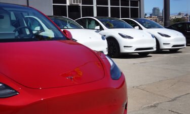 Tesla cars sit in a dealership lot in March 28