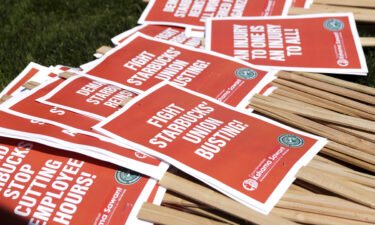 Picket signs are seen during the "Fight Starbucks' Union Busting" rally in Seattle on April 2. The US labor board is suing Starbucks to rehire unionizing employees.