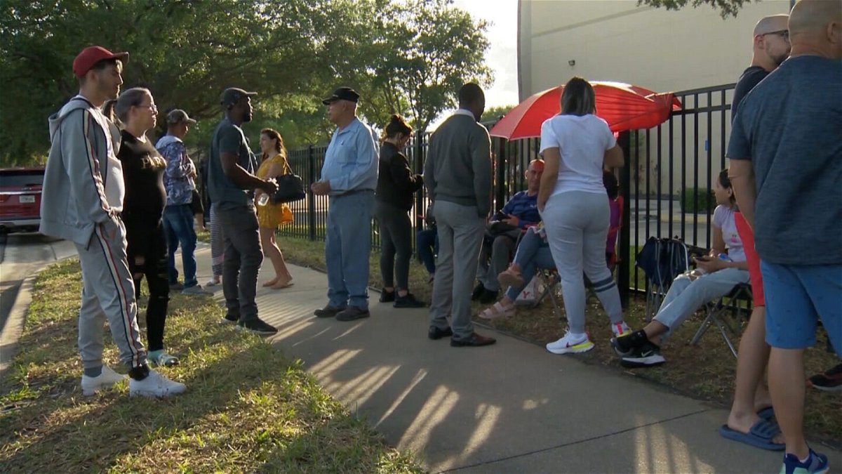 <i>WESH</i><br/>People seen waiting outside the US Immigration and Customs Enforcement office in Orlando