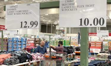 Customers shop for clothing at a Costco store on July 13