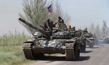 Service members of pro-Russian troops drive armored vehicles near Novoazovsk in Ukraine's eastern Donetsk region on May 6.