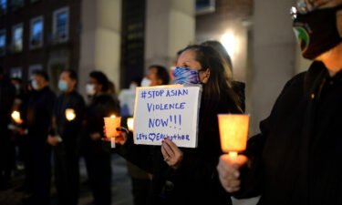 People attend a candlelight vigil in New York in 2021 after the Atlanta spa shootings. A new report shows only 7 of 233 reported attacks against Asian Americans in NYC in 2021 led to hate crime convictions.