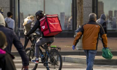 A bike messenger carries a DoorDash Inc. bag in San Francisco