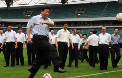 Chinese leader Xi Jinping kicks a soccer ball in Qinhuangdao in 2008. China has pulled out of hosting the 2023 Asian Football Confederation (AFC) Asia Cup.