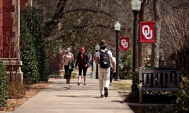 Students walk on campus at the University of Oklahoma in March 2015.
