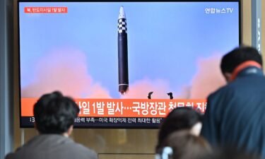 People in Seoul watch a news broadcast showing footage of a North Korean missile test.