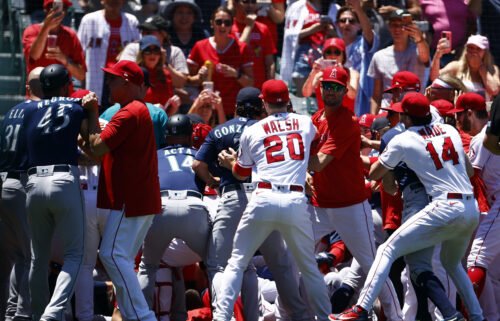 The Seattle Mariners and the Los Angeles Angels clear the benches after Seattle's Jesse Winker charged the Angels dugout after being hit by a pitch in the second inning.