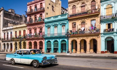 Classic cars are part of the Old Havana scene. Cuba has been moved to Level 1