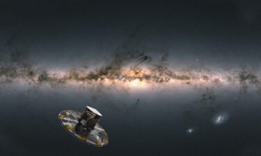 An artist's impression of ESA's Gaia satellite observing the Milky Way and the background image of the sky is compiled from data from more than 1.8 billion stars.