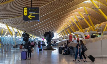 Passengers wait in the departures hall at Madrid Barajas Airport in Spain earlier this year.