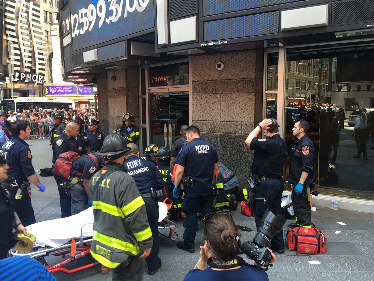 <i>FDNY/twitter</i><br/>First responders attend to a person after a car was driven into pedestrians in Times Square in 2017.
