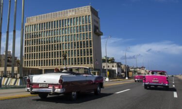 Tourists ride classic convertibles in Havana
