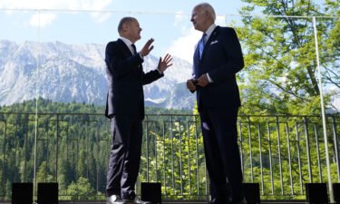President Joe Biden and German Chancellor Olaf Scholz stand together and speak during a bilateral meeting at the G7 Summit in Elmau