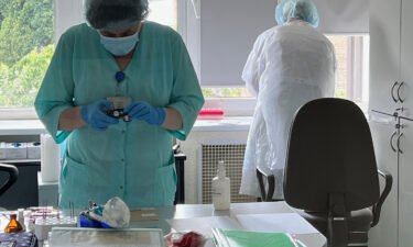Analysts process DNA samples at the Ministry of Internal Affairs' laboratory in Kyiv