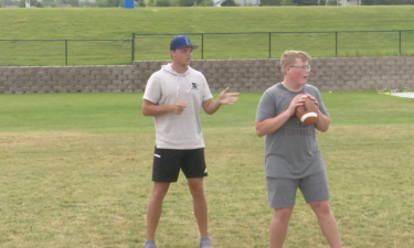 Former Century quarterback Nate Manning gives instruction at camp