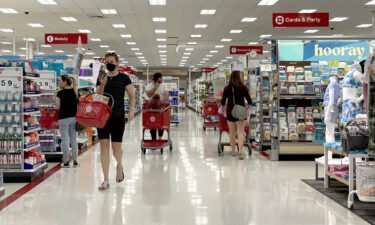 Most major grocery stores and retailers are open and pictured customers shop at a Target store on June 8