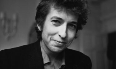 American folk/rock singer and songwriter Bob Dylan smiles during a meeting with the British press