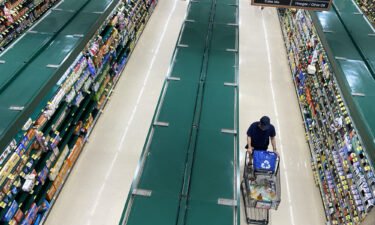 People shop at a supermarket in Arlington