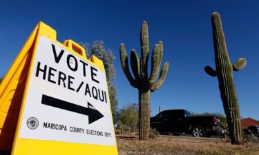 A Maricopa County Elections Department sign directs voters to a polling station on November 8