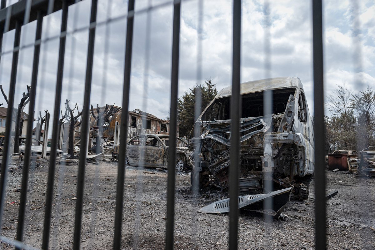 <i>Toby Hancock/CNN</i><br/>Burned out cars and homes in the aftermath of the wildfire that tore through Dagenham.
