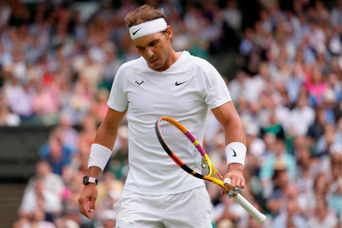 <i>Kirsty Wigglesworth/AP</i><br/>Spain's Rafael Nadal reacts after losing a point as he plays Taylor Fritz of the US in a men's singles quarterfinal match on day 10 of the Wimbledon tennis championships in London