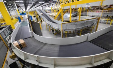 Amazon packages move on a conveyor belt during a tour of the advanced robotics facility fulfillment centre
