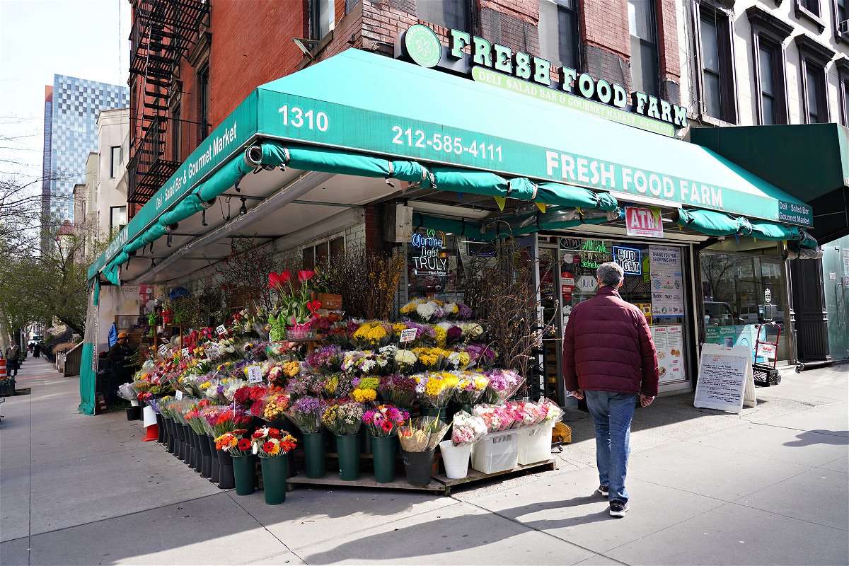 <i>Cindy Ord/Getty Images</i><br/>A view of a bodega selling colorful flowers in New York City.