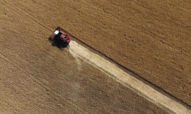 This aerial picture taken on July 7 shows a farmer harvesting wheat near Kramatosk in the Donetsk Oblast