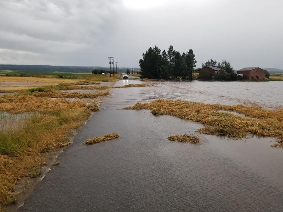 Water and debris briefly over some county roads Saturday