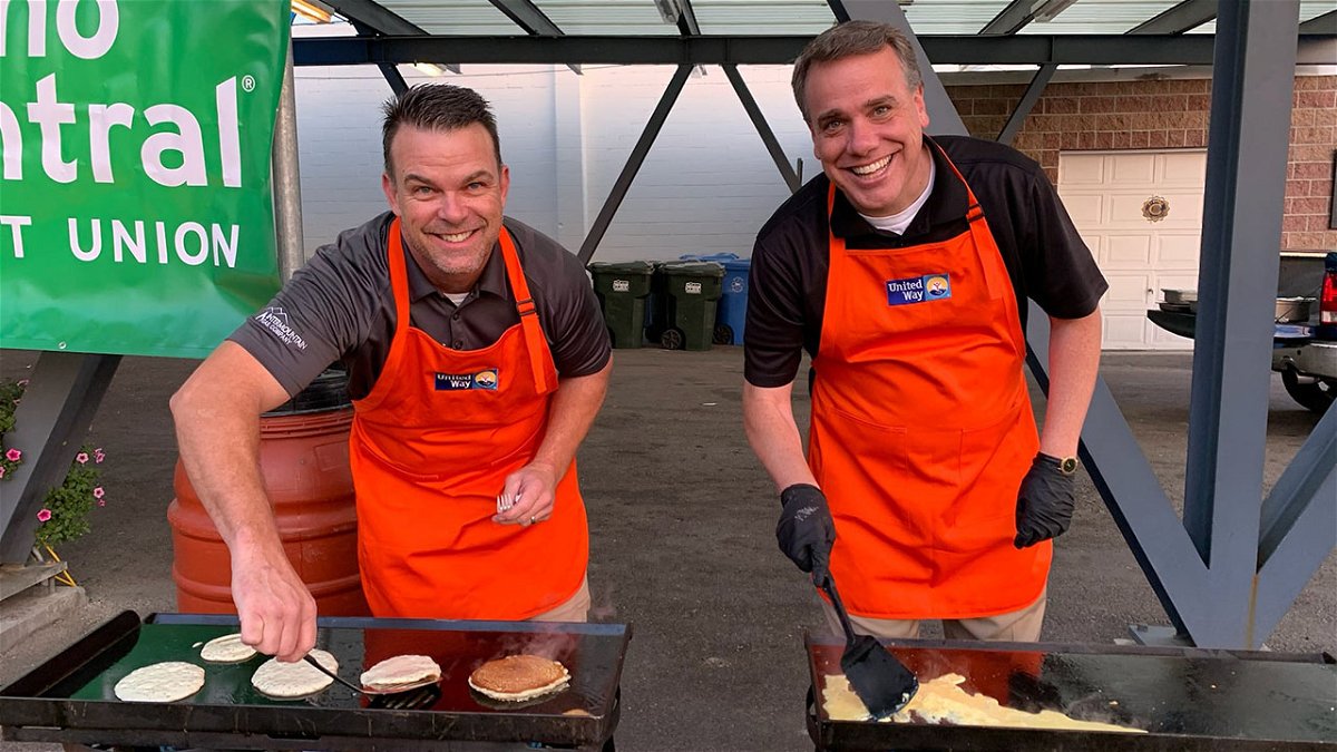 United Way of Southeastern Idaho board members J.J. Murphy (left) and Shane Hunt flip pancakes at the 2021 Campaign Kick-off Breakfast.