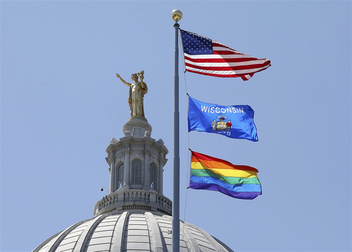 <i>John Hart/AP</i><br/>A rainbow flag observing Pride Month is displayed over the east wing of the Wisconsin State Capitol in Madison