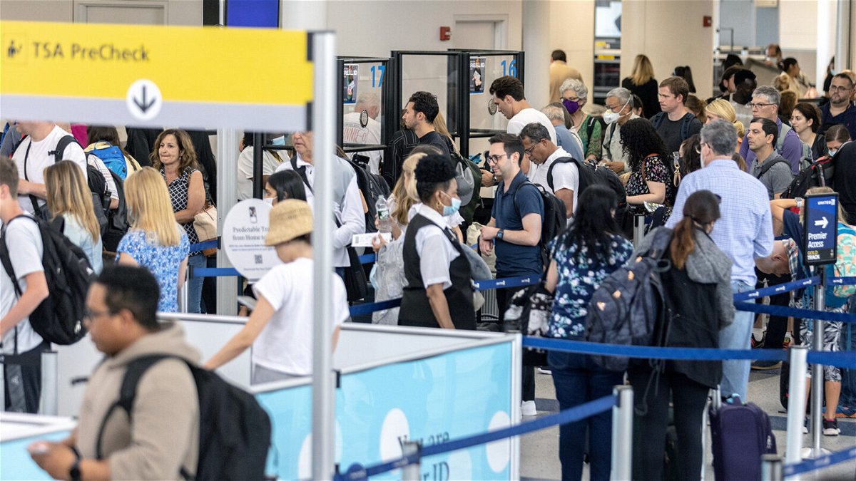 <i>Jeenah Moon/Getty Images</i><br/>Travelers line up to enter a security checkpoint at Newark Liberty International Airport (EWR) on July 1 in Newark