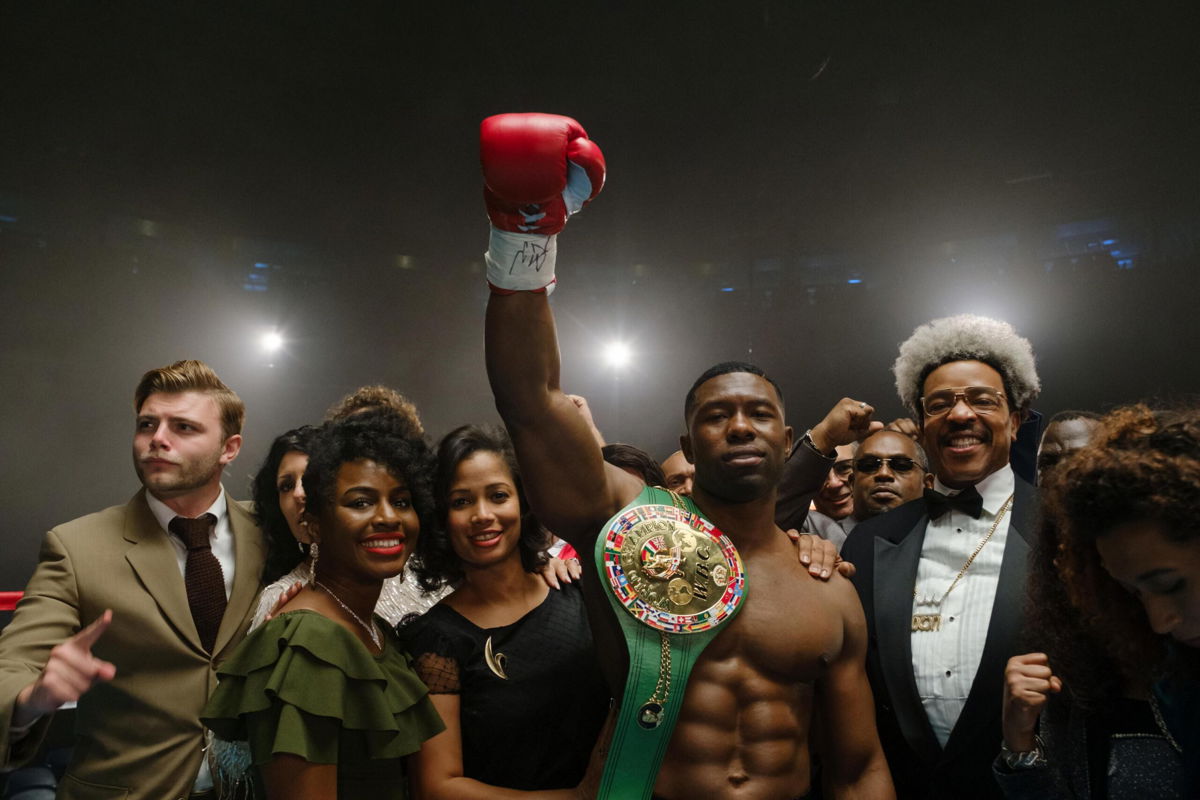 <i>Patti Perret/ HULU</i><br/>Trevante Rhodes (second from right) as Mike Tyson and Russell Hornsby as Don King in Hulu's 'Mike.'