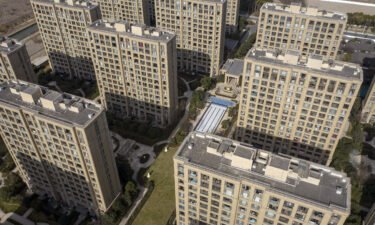 China slashes mortgage rates to tackle the deepening property crisis. Pictured are apartment buildings at the Magnolia Mansion residential project in Shanghai