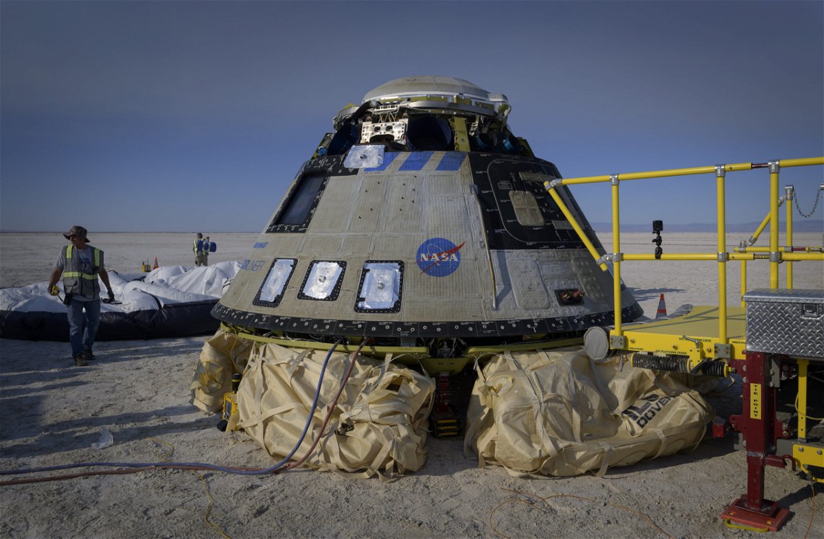 <i>Bill Ingalls/NASA/Getty Images/FILE</i><br/>Boeing and NASA teams work around Boeings CST-100 Starliner spacecraft on May 25 at the White Sands Missle Range