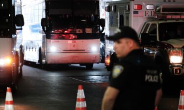 A bus carrying migrants who crossed the border from Mexico into Texas arrives into the Port Authority station.