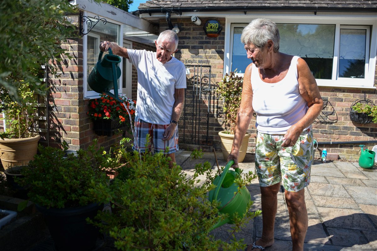 <i>Martin Brown for CNN</i><br/>David and Margaret Miller water their plants at their home in Edenbridge.