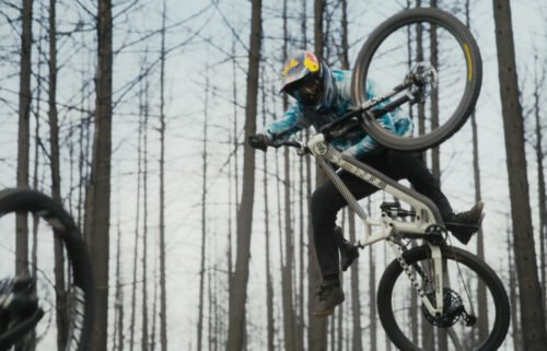 Hurtling simultaneously down a dirt-track on a mountain bike may not be everyone's idea of fun
