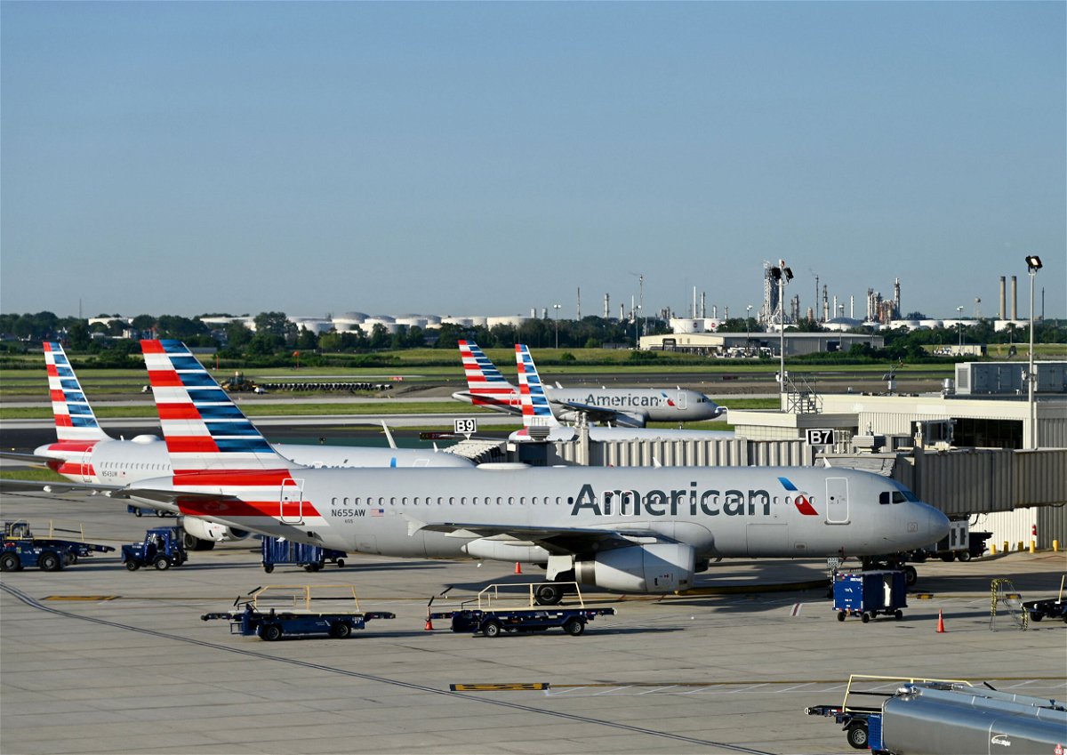 <i>Daniel Slim/AFP/Getty Images</i><br/>American Airlines says it is cutting 2% of flights from its schedule in September and October. Planes are seen here in June at its hub in Philadelphia