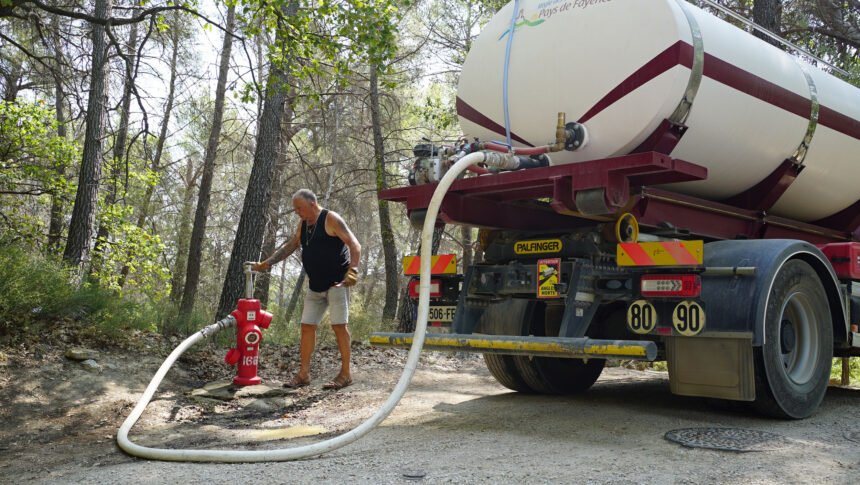 <i>Joseph Ataman/CNN</i><br/>Daniel Martel fills a water truck bought by local authorities in the village of Seillans on August 10 to replenish reservoirs in a district that has run out of tap water.