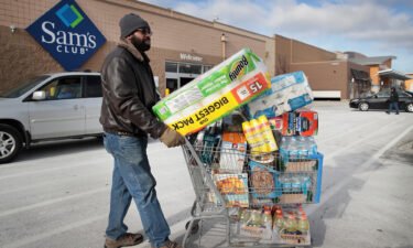 A shopper stocks up on merchandise at a Sam's Club store on January 12