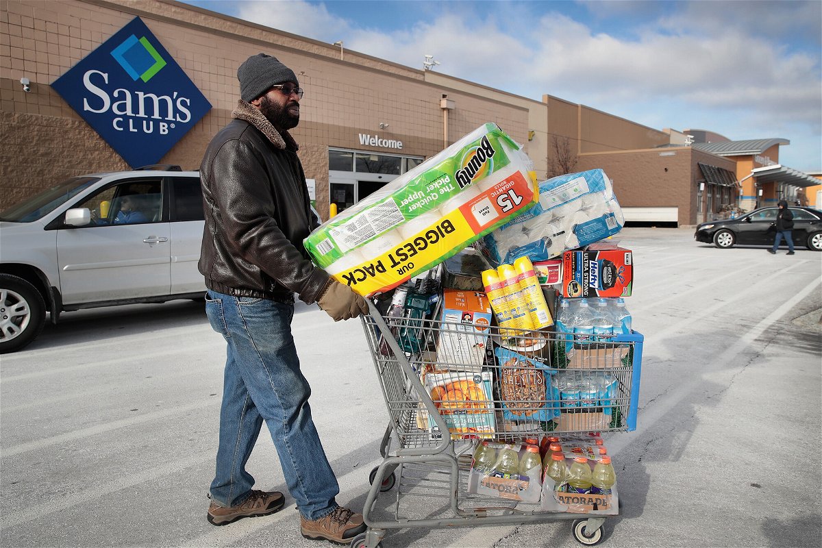 <i>Scott Olson/Getty Images</i><br/>A shopper stocks up on merchandise at a Sam's Club store on January 12