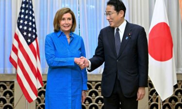 House Speaker Nancy Pelosi shakes hands with Japan's Prime Minister Fumio Kishida in Tokyo on August 5.