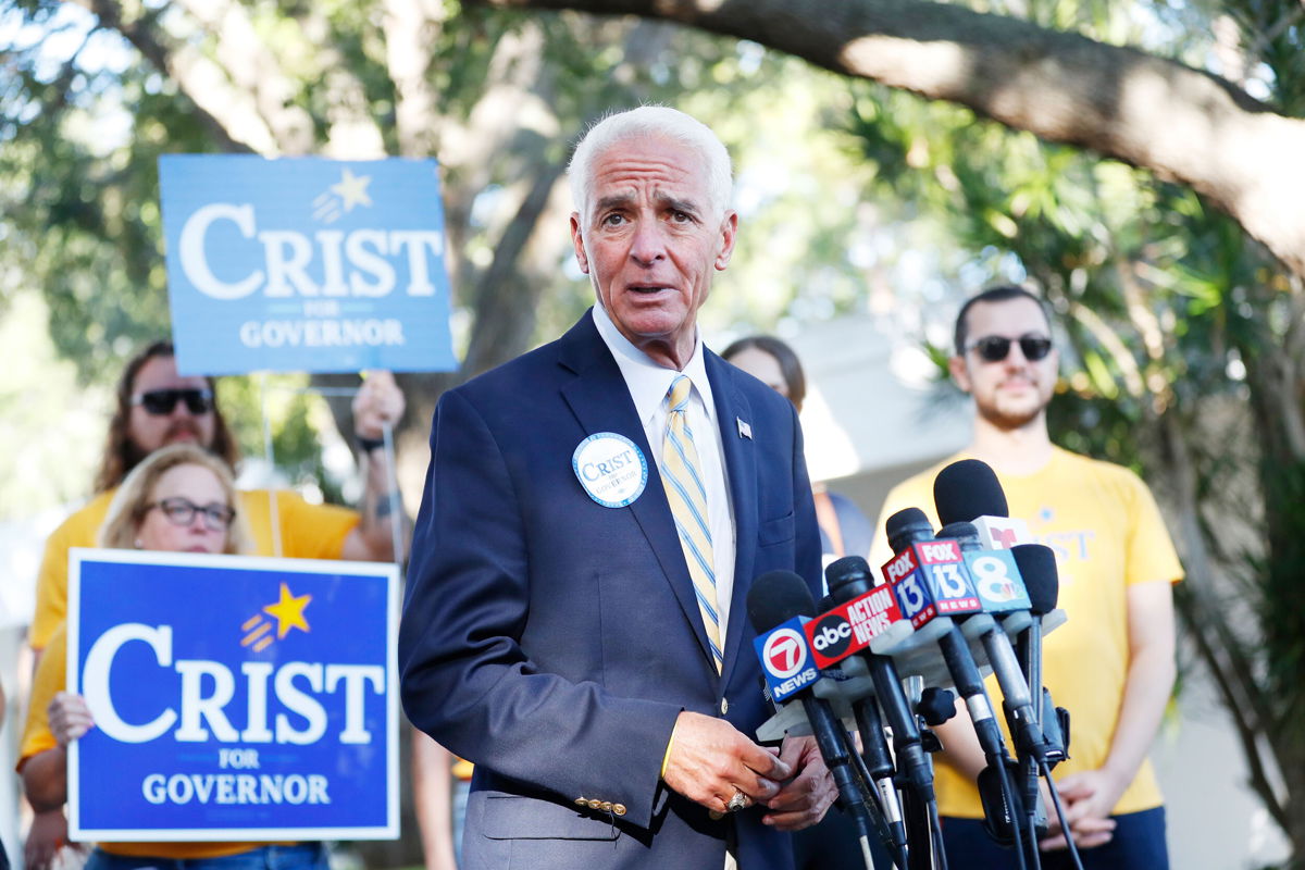 <i>Octavio Jones/Getty Images</i><br/>Rep. Charlie Crist speaks to the media before casting his vote in the primary election on August 23 in St Petersburg