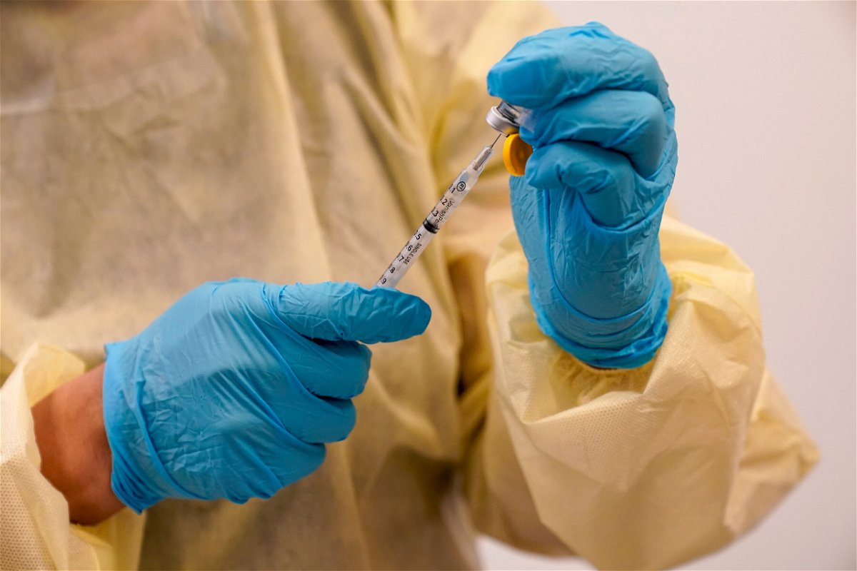 <i>Mary Altaffer/AP</i><br/>Health officials are banking on vaccinations to contain monkeypox and polio before those become standing threats in the United States. A physician assistant prepares a syringe with the monkeypox vaccine in New York on August 19.