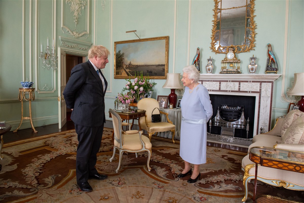 <i>Dominic Lipinski/Pool/Getty Images</i><br/>The Queen meets Boris Johnson at Buckingham Palace in June 2021.