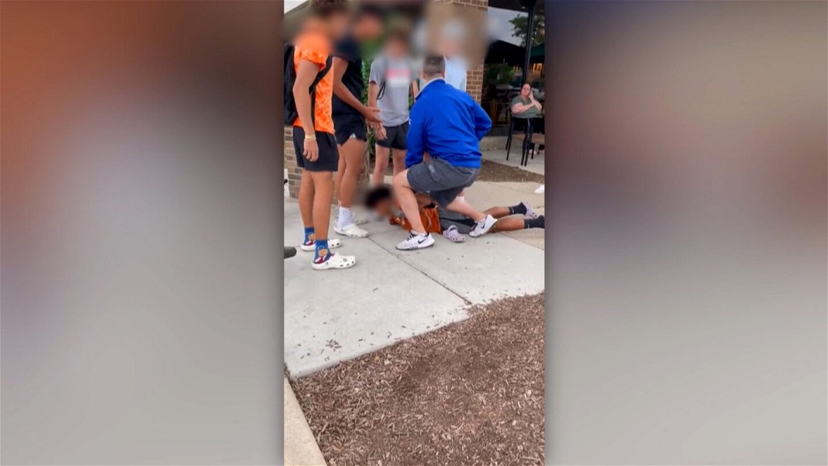 <i>Nicole Nieves</i><br/>A screengrab from video obtained by CNN shows Vitellaro with his knee on a teenage boy. A portion of this image has been blurred to protect identities.