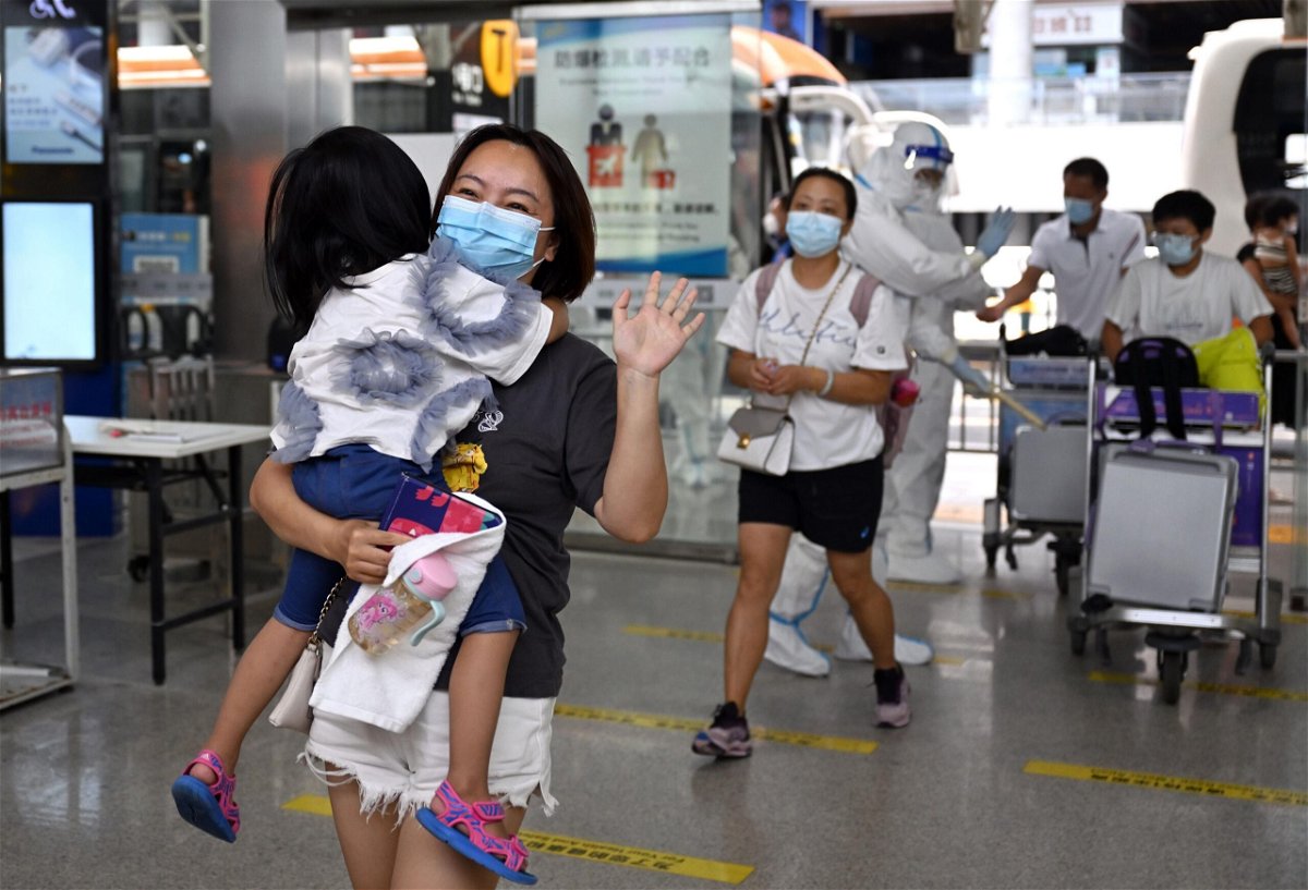 <i>Guo Cheng/Xinhua/Getty Images</i><br/>Stranded tourists prepare to board their flight at Sanya Phoenix International Airport in Sanya