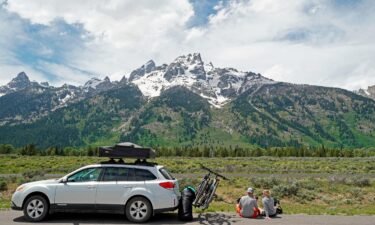 A couple parks on the side of the road to have lunch in Grand Teton National Park in June 2020 outside Jackson