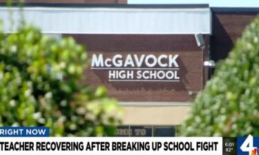 A teacher was injured after attempting to break up a fight between students.